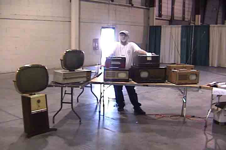 Dave Sica with some of his televisions on display